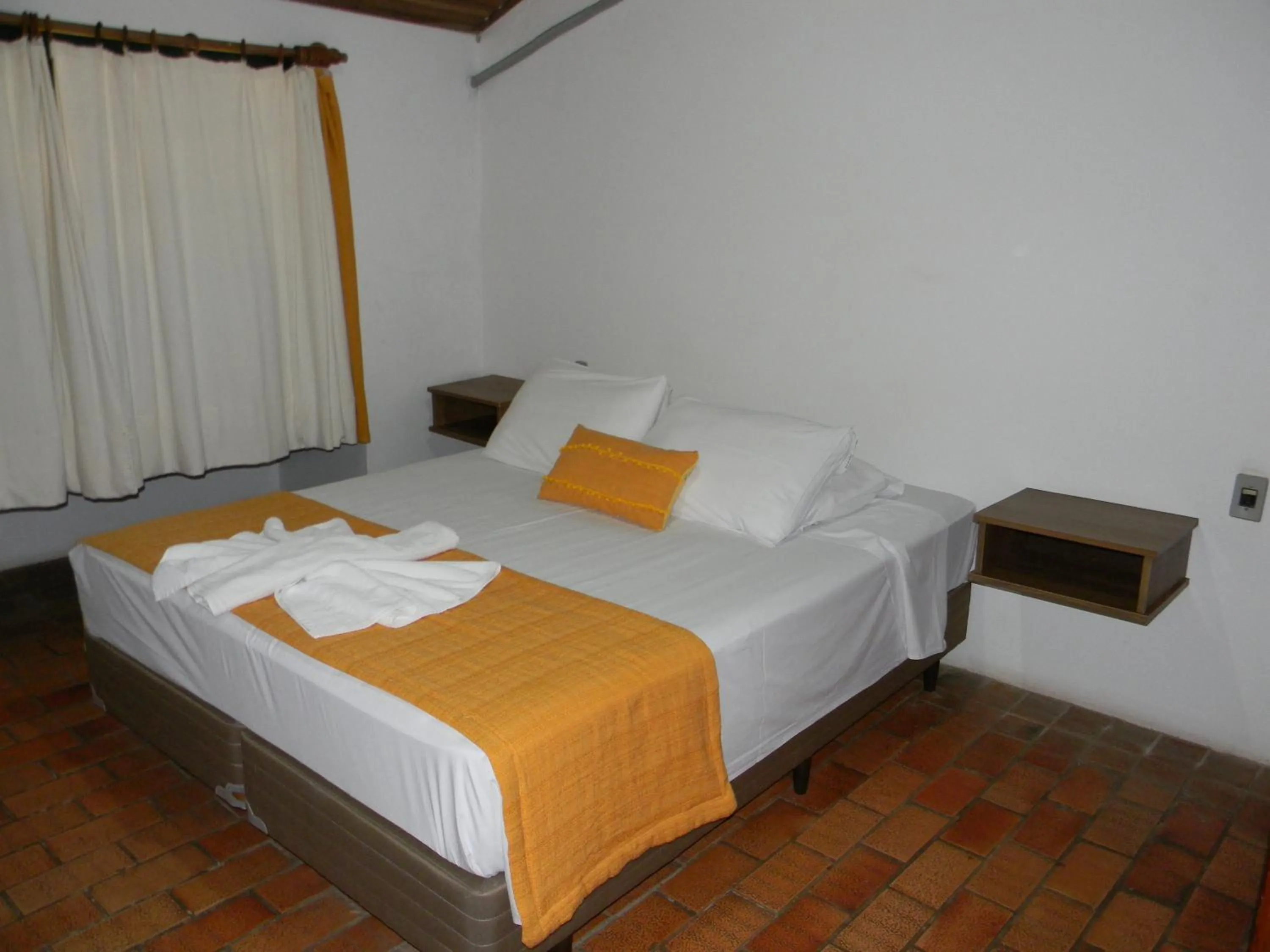 Bed in Pousada Recanto da Prainha
