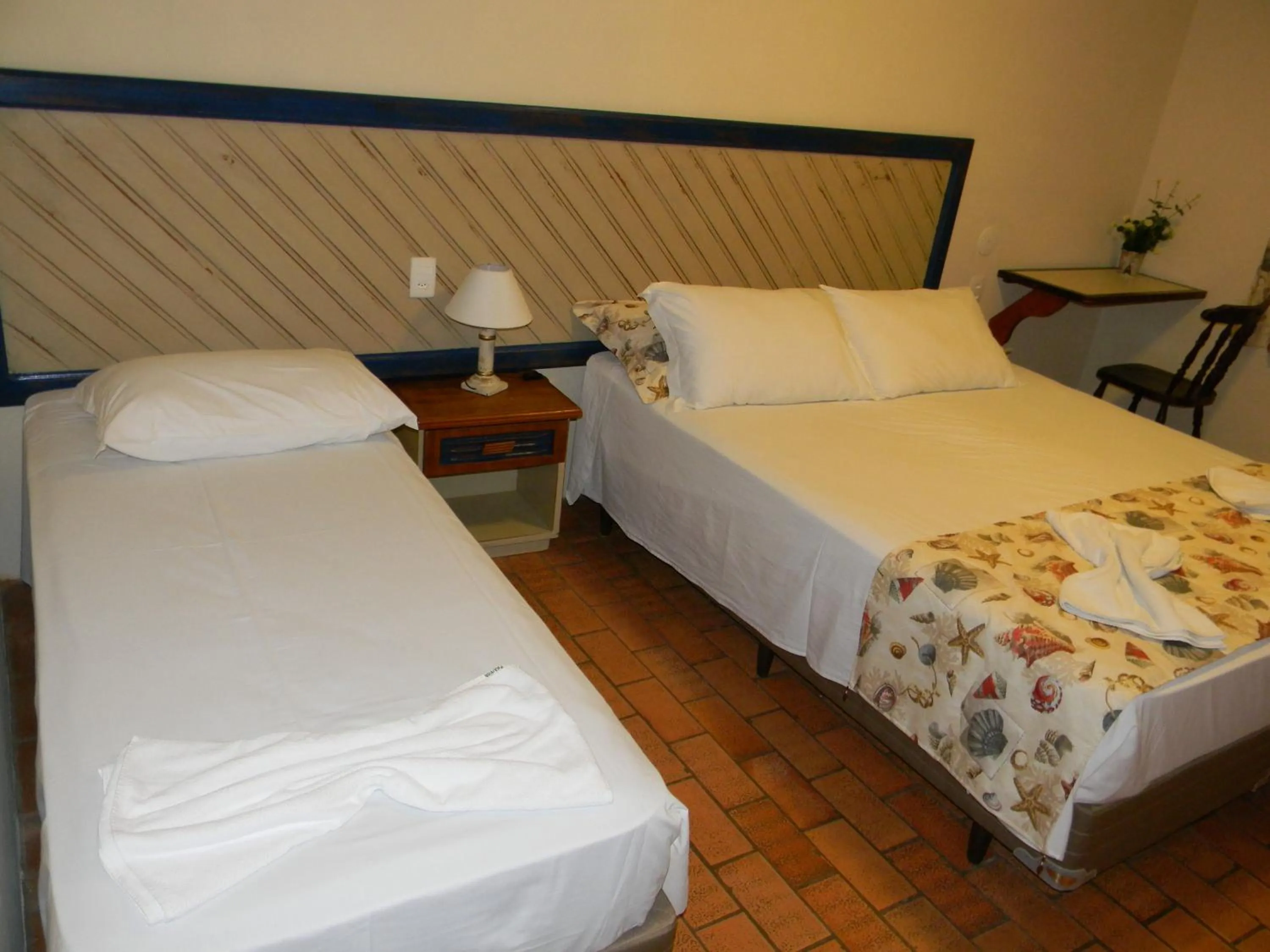 Bed in Pousada Recanto da Prainha