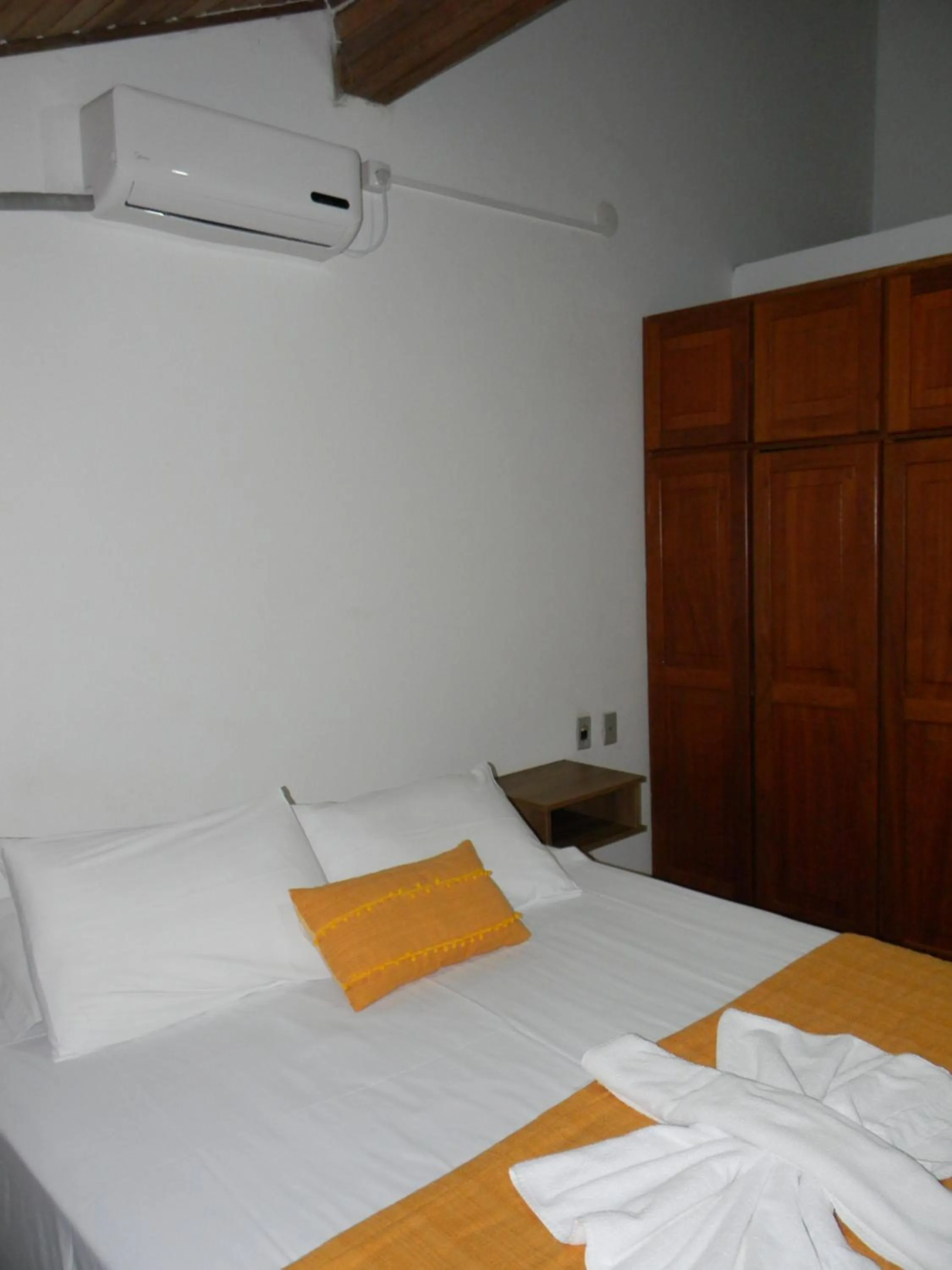 Bed in Pousada Recanto da Prainha