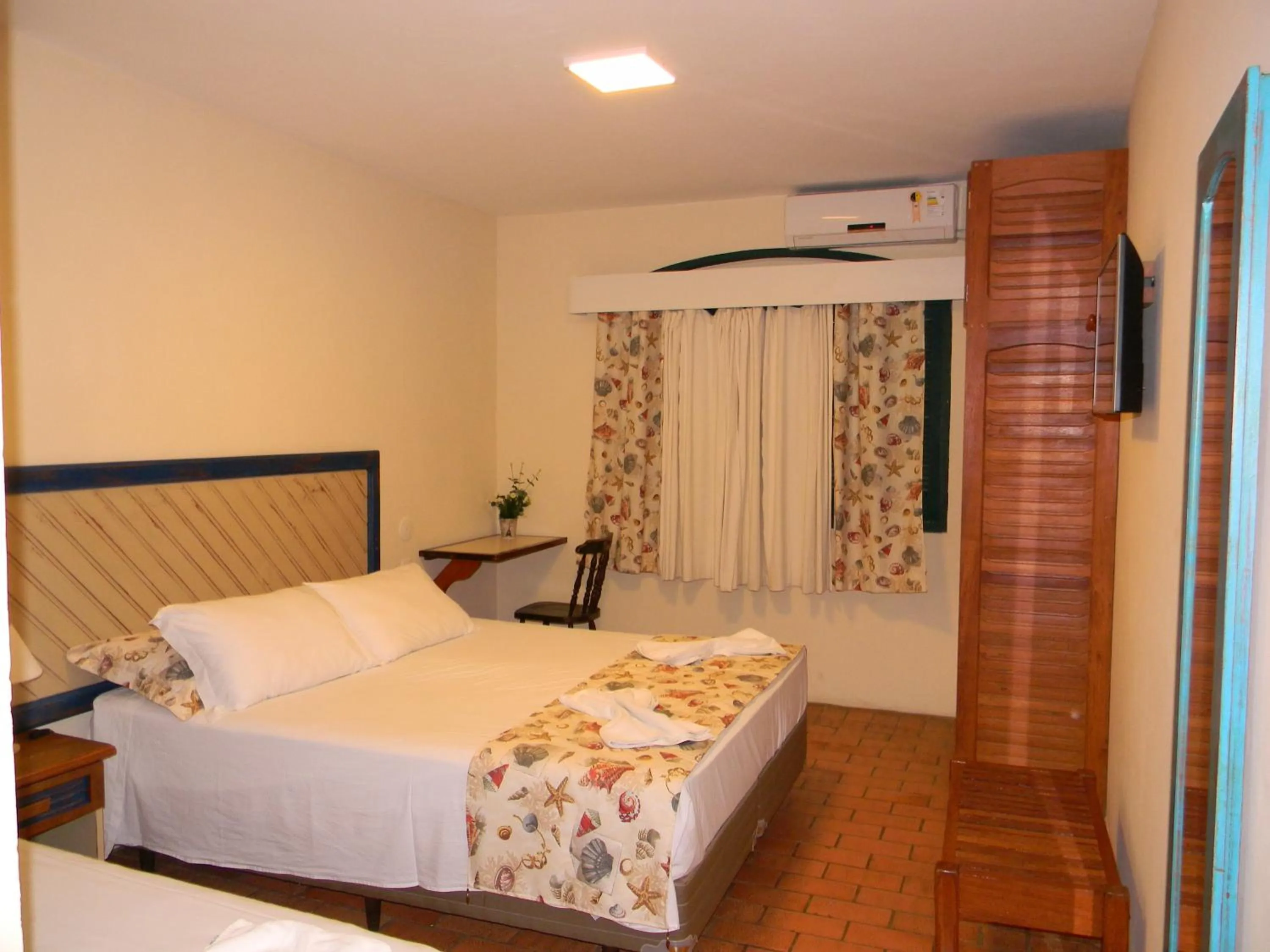 Bed in Pousada Recanto da Prainha