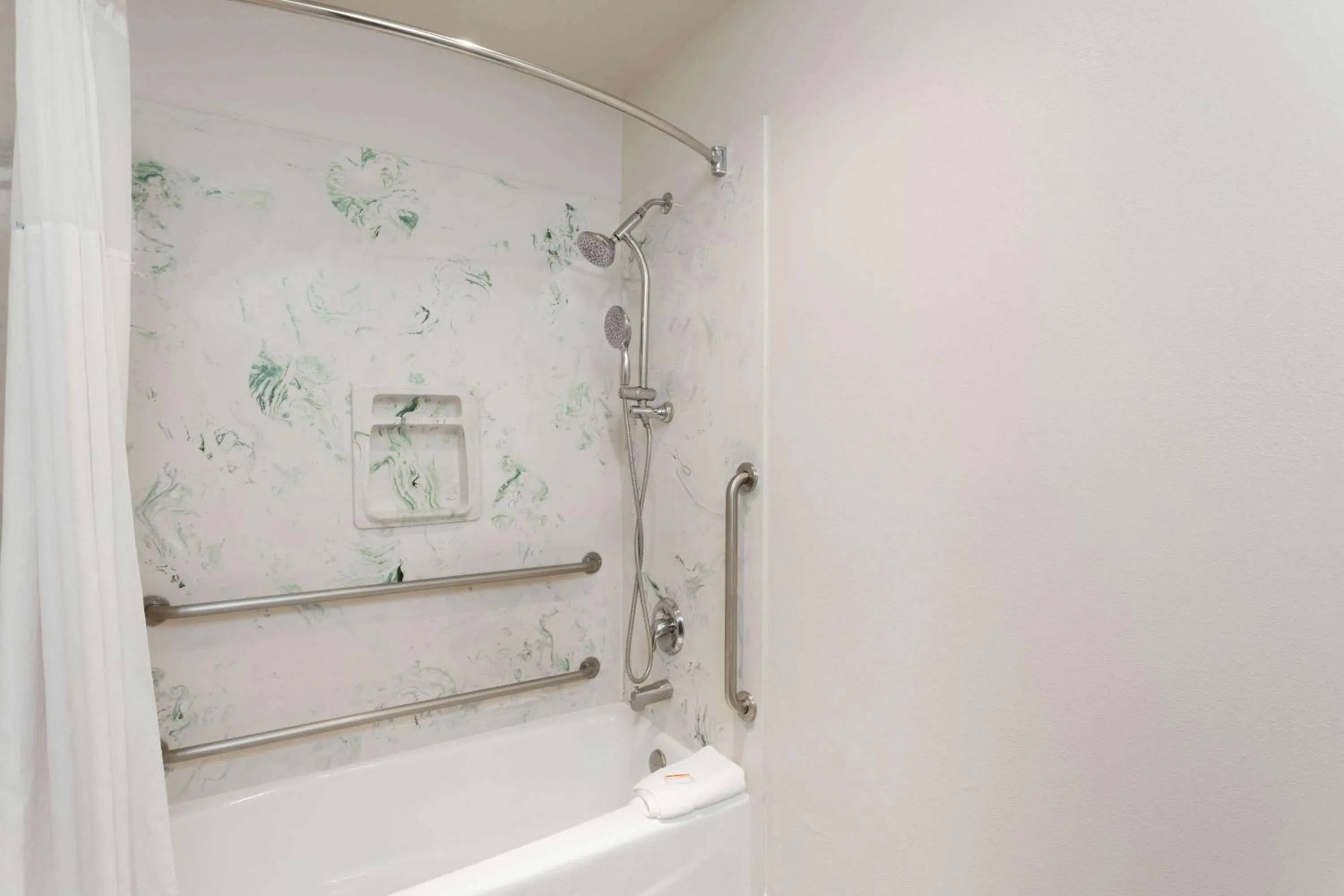 Bathroom in Days Inn & Suites by Wyndham South Gate