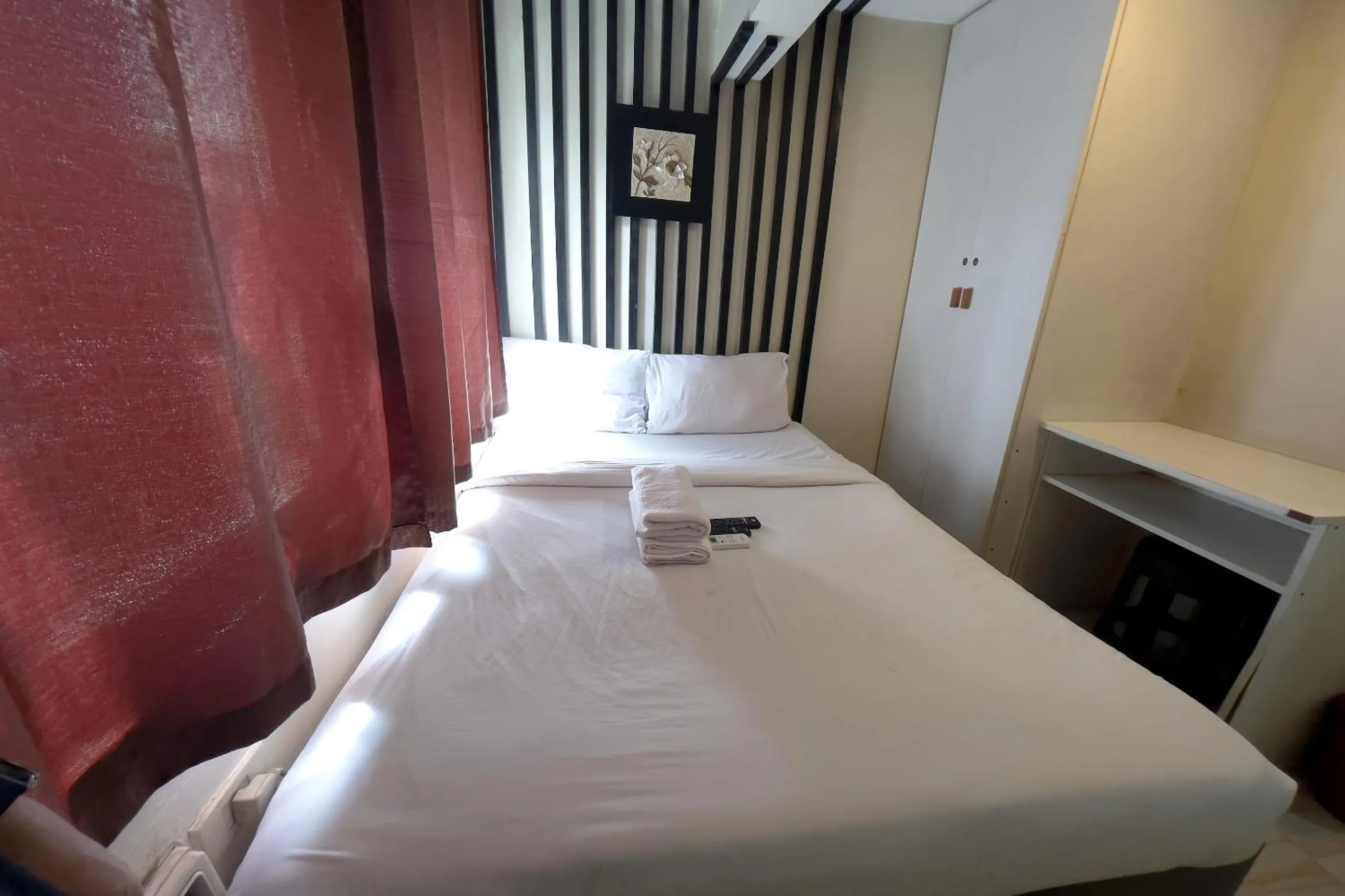 Bed in Jardin Oriental Suites Ubelt Manila