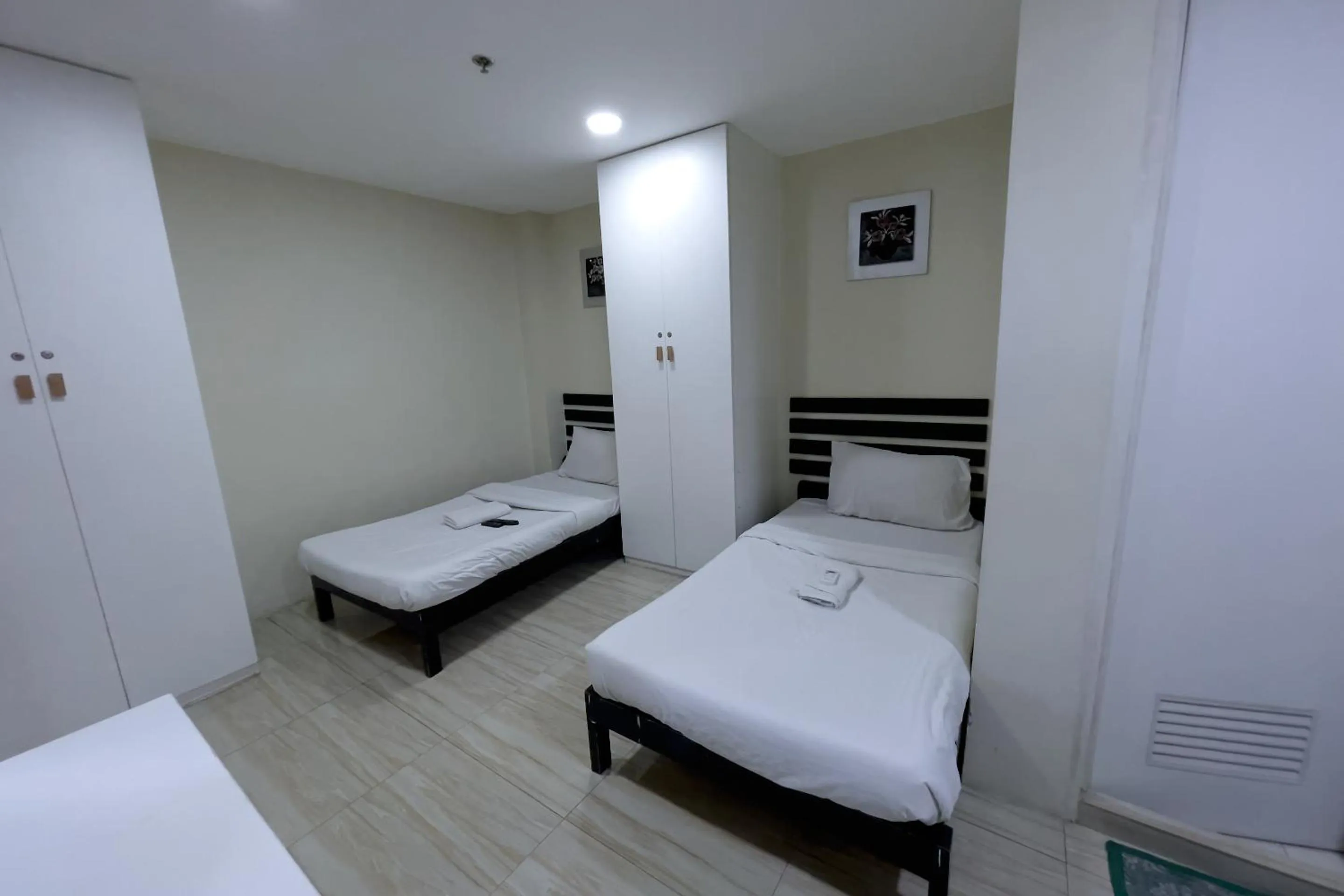 Bed in Jardin Oriental Suites Ubelt Manila