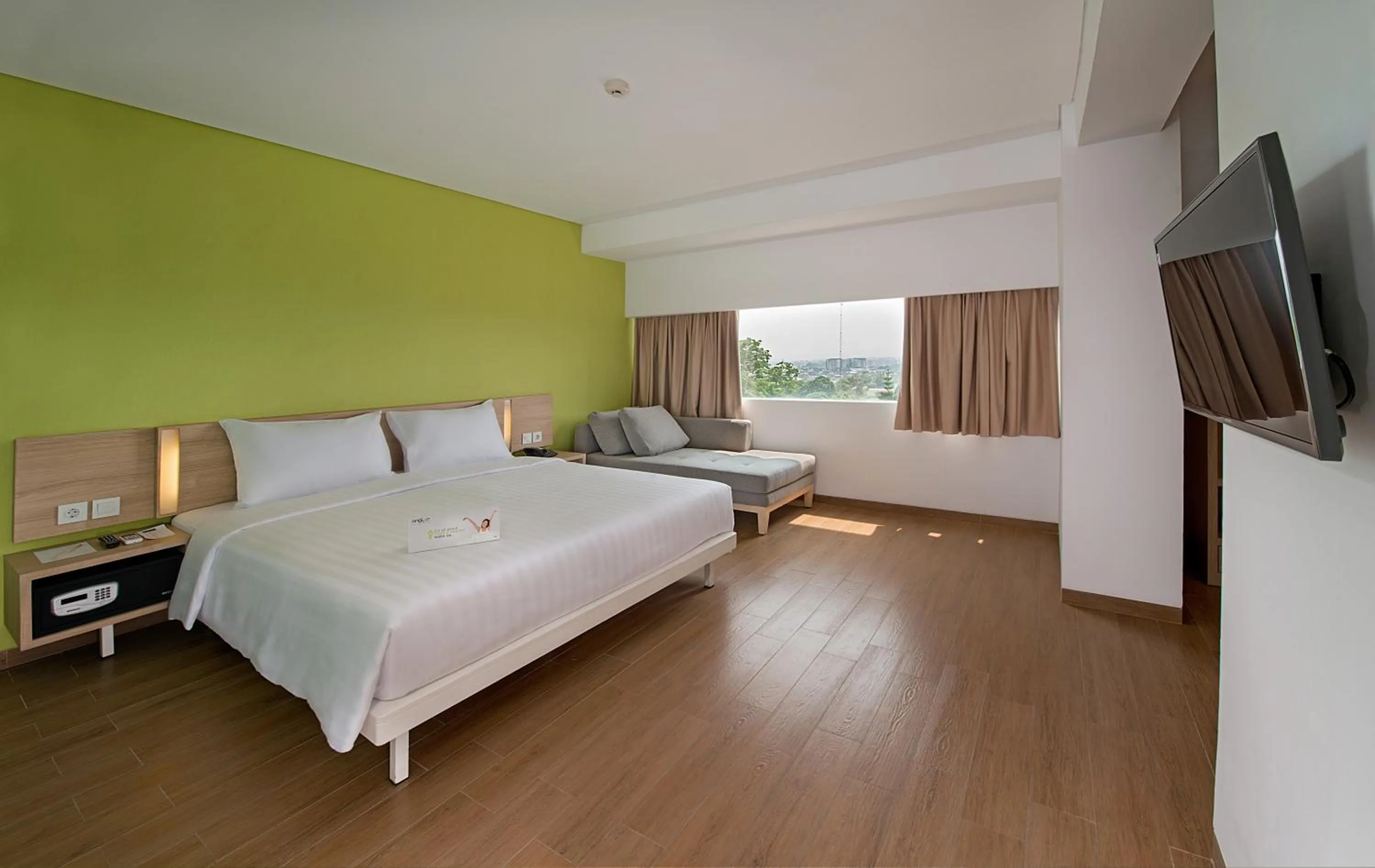Property building, Bed in Whiz Prime Hotel Pajajaran Bogor