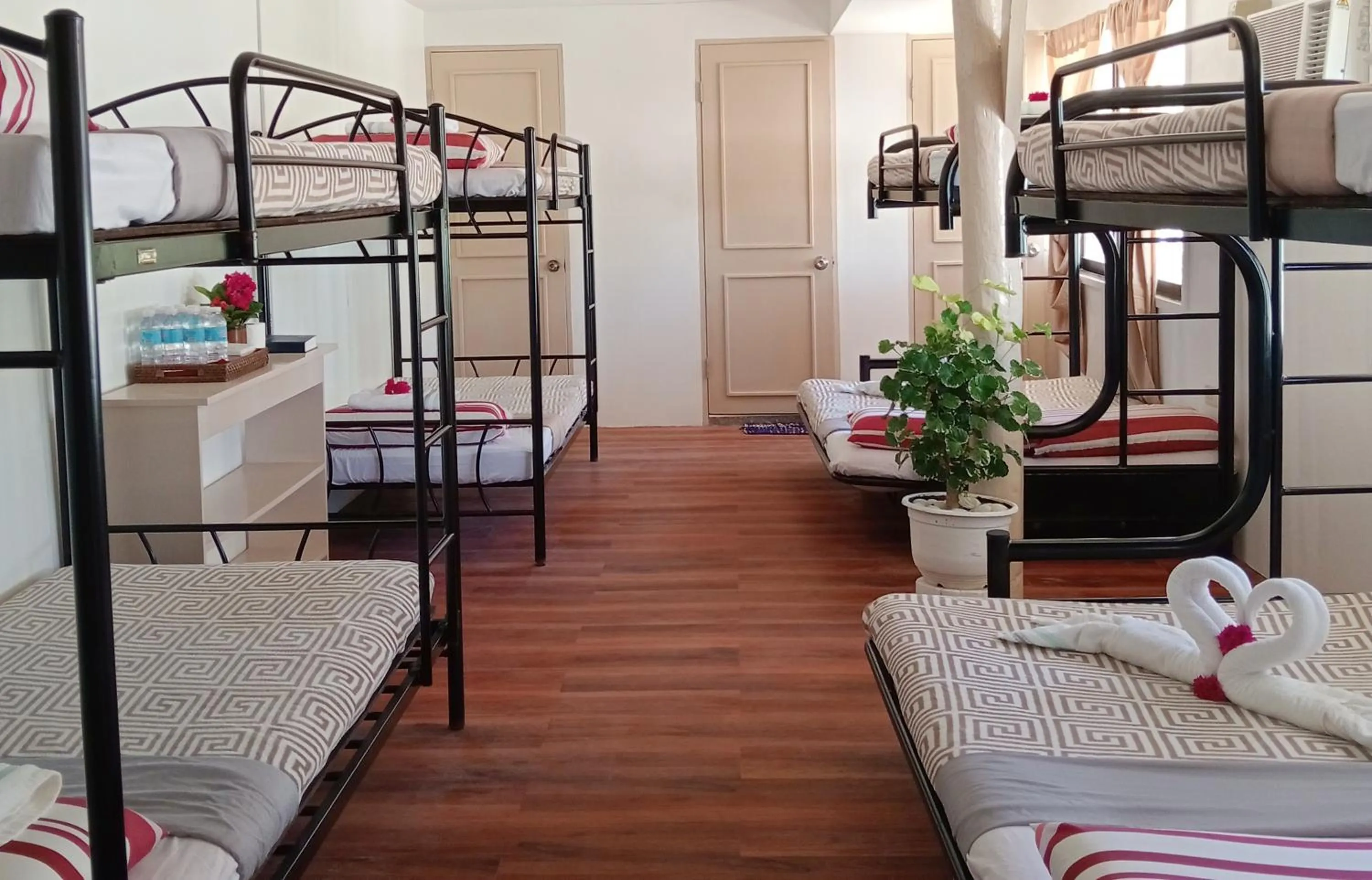 Bed in Nalusuan Island Resort and Marine Sanctuary