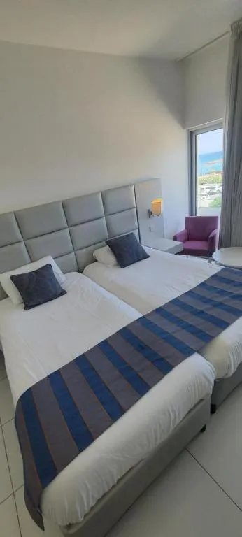 Bed in Silver Sands Beach Hotel