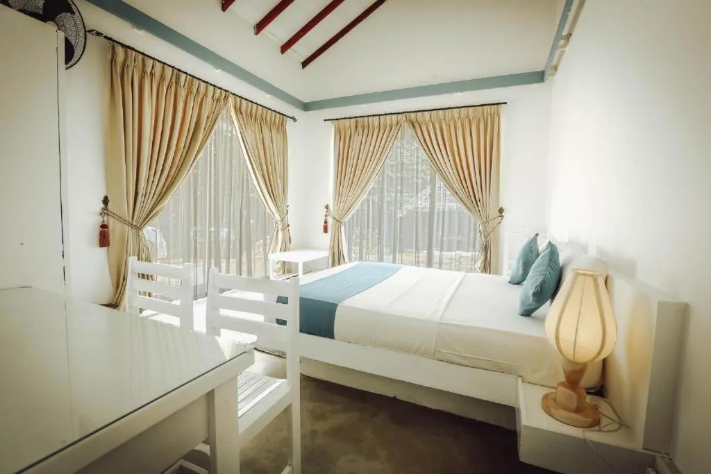 Bed in The Beach house by Kay Jay Hotels