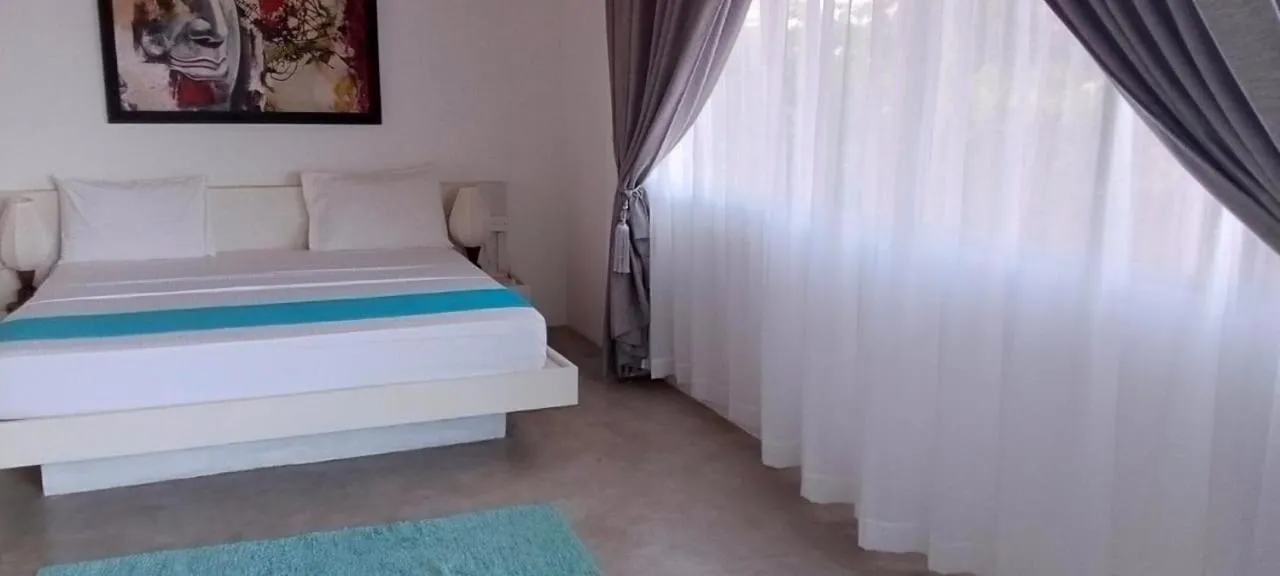 Bed in The Beach house by Kay Jay Hotels