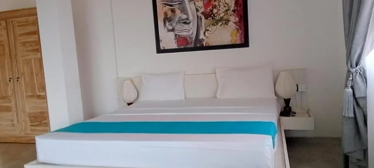 Bed in The Beach house by Kay Jay Hotels