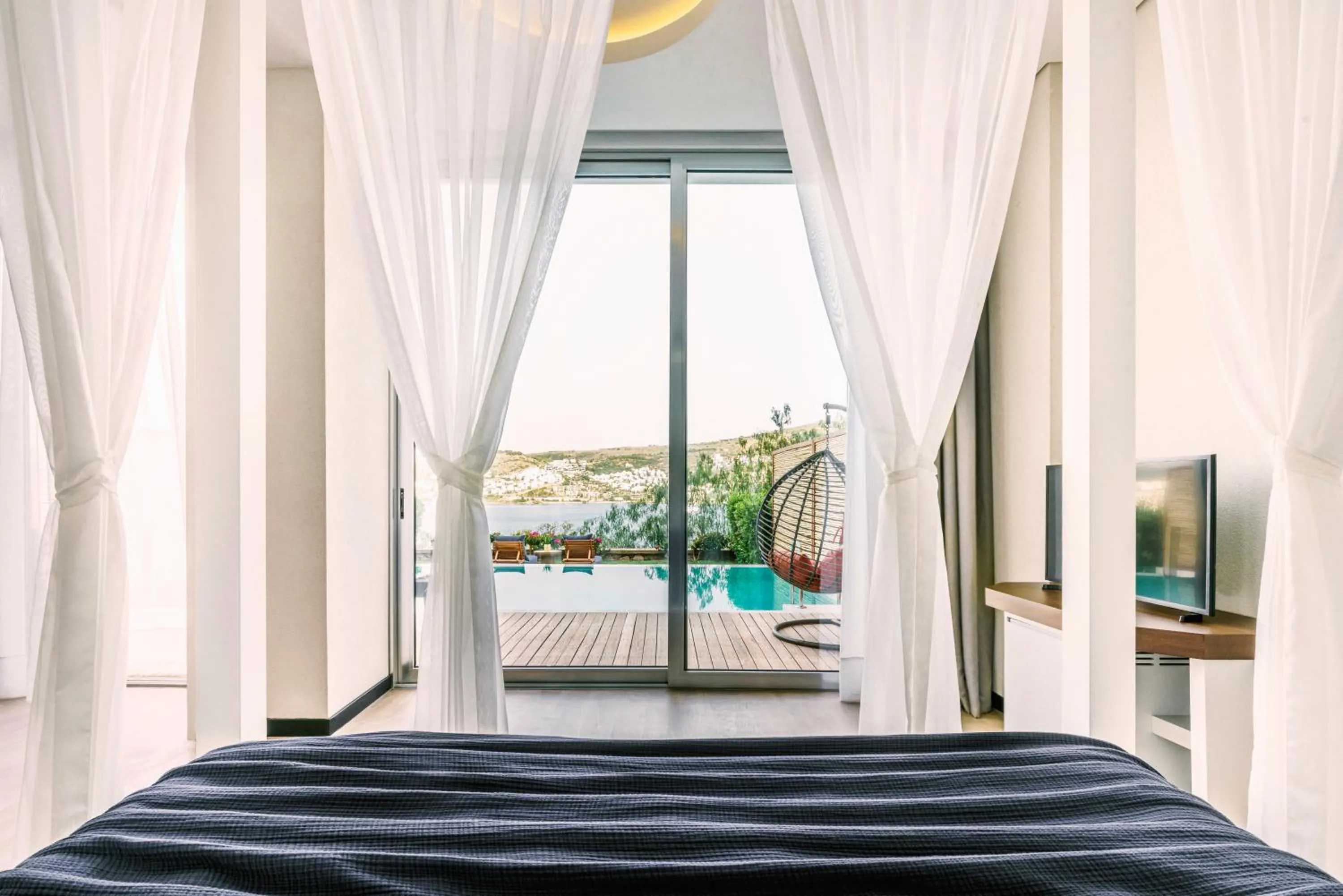 Pool view, Bed in Cape Bodrum Luxury Hotel & Beach