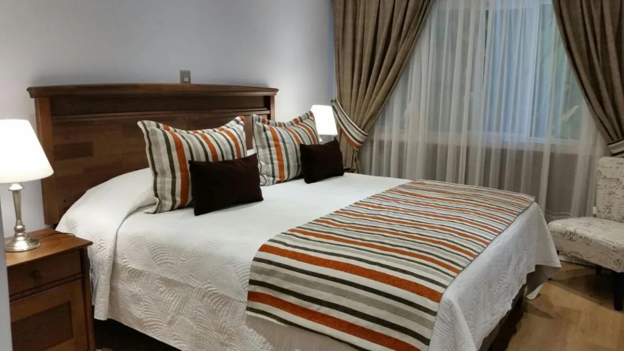 Bed in Hotel Puerta del Lago