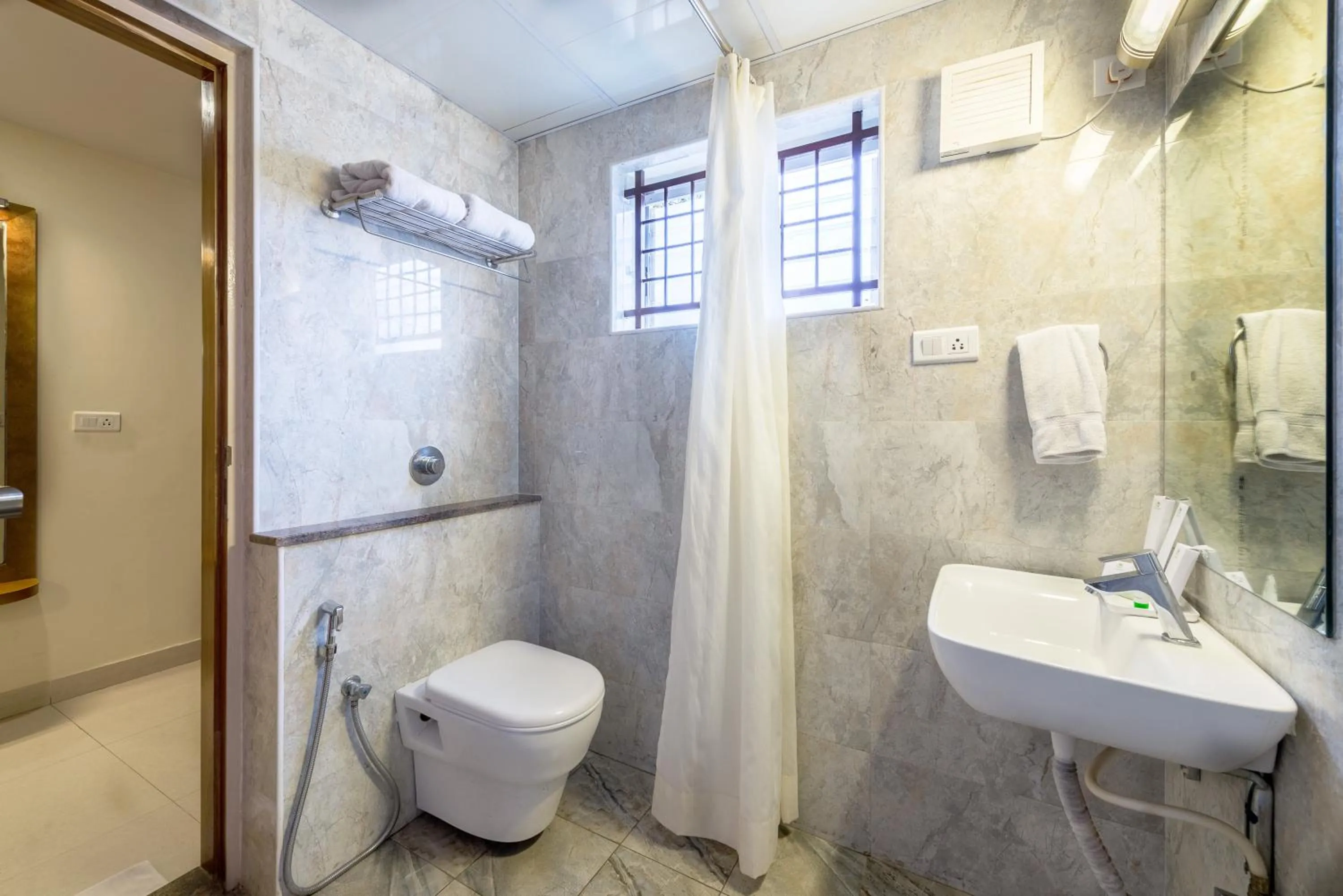 Bathroom in Treebo Akshaya Lalbagh Inn