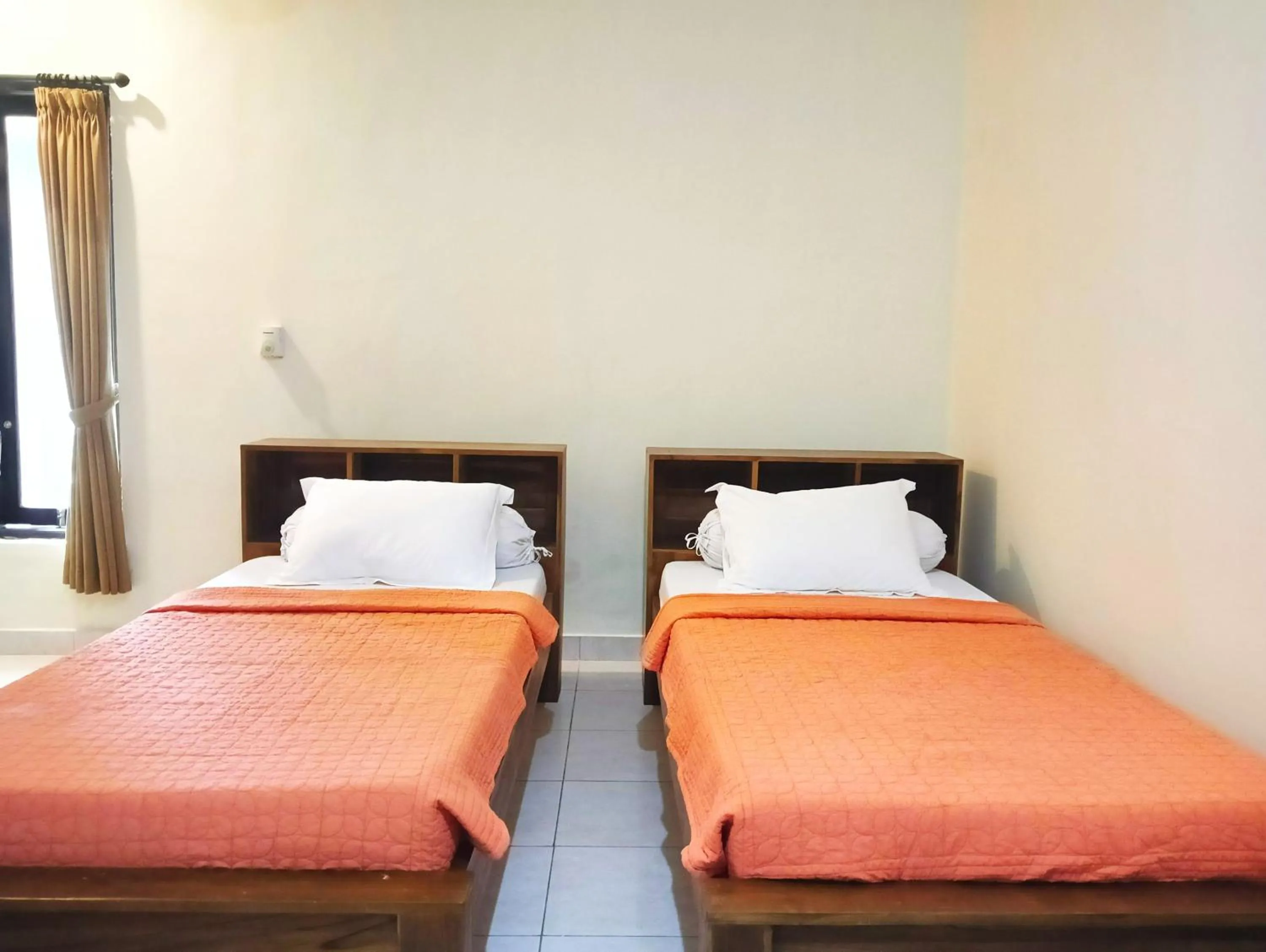 Bed in Puri Asri Bungalow Ubud