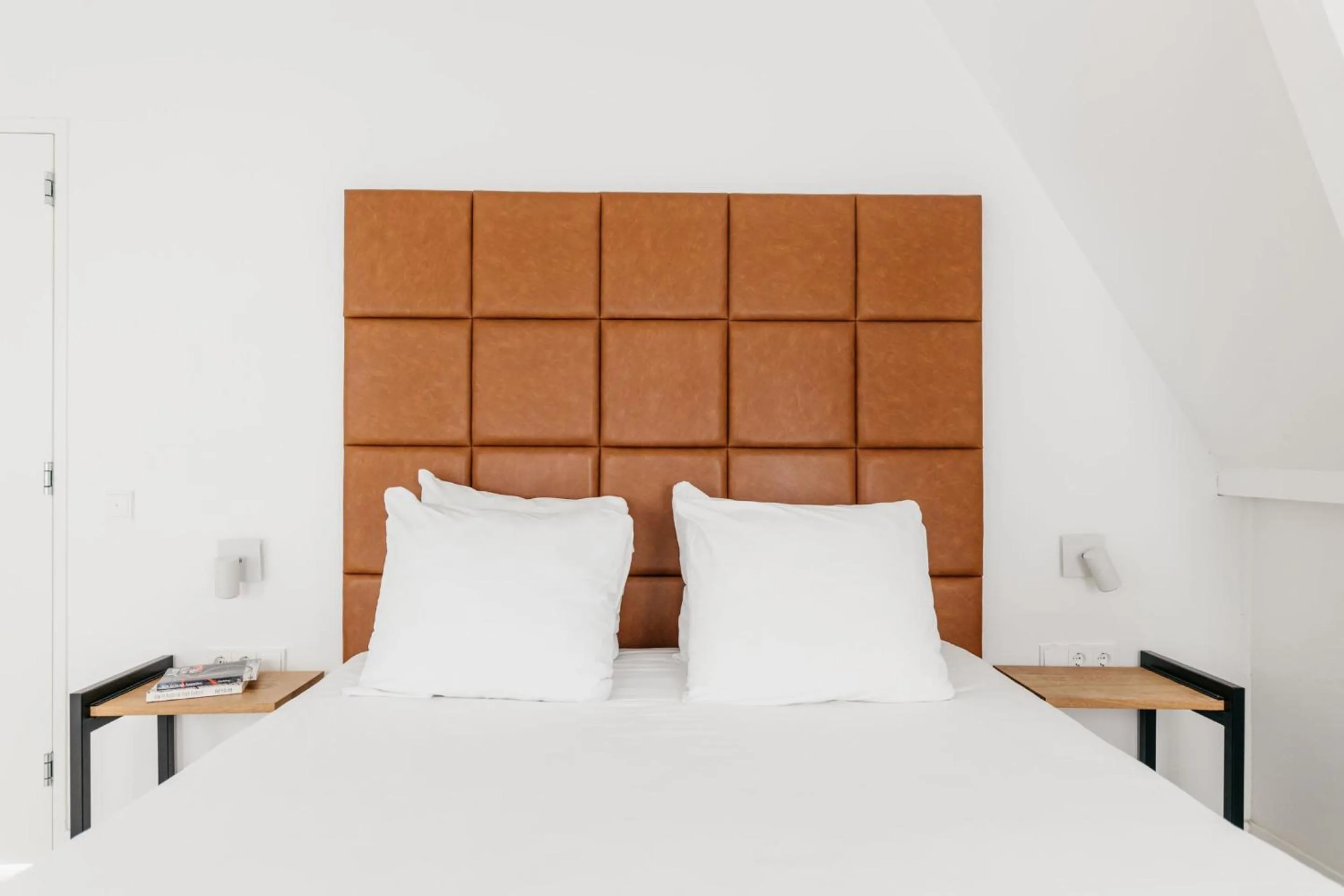 Bed in YAYS Amsterdam Salthouse Canal by Numa