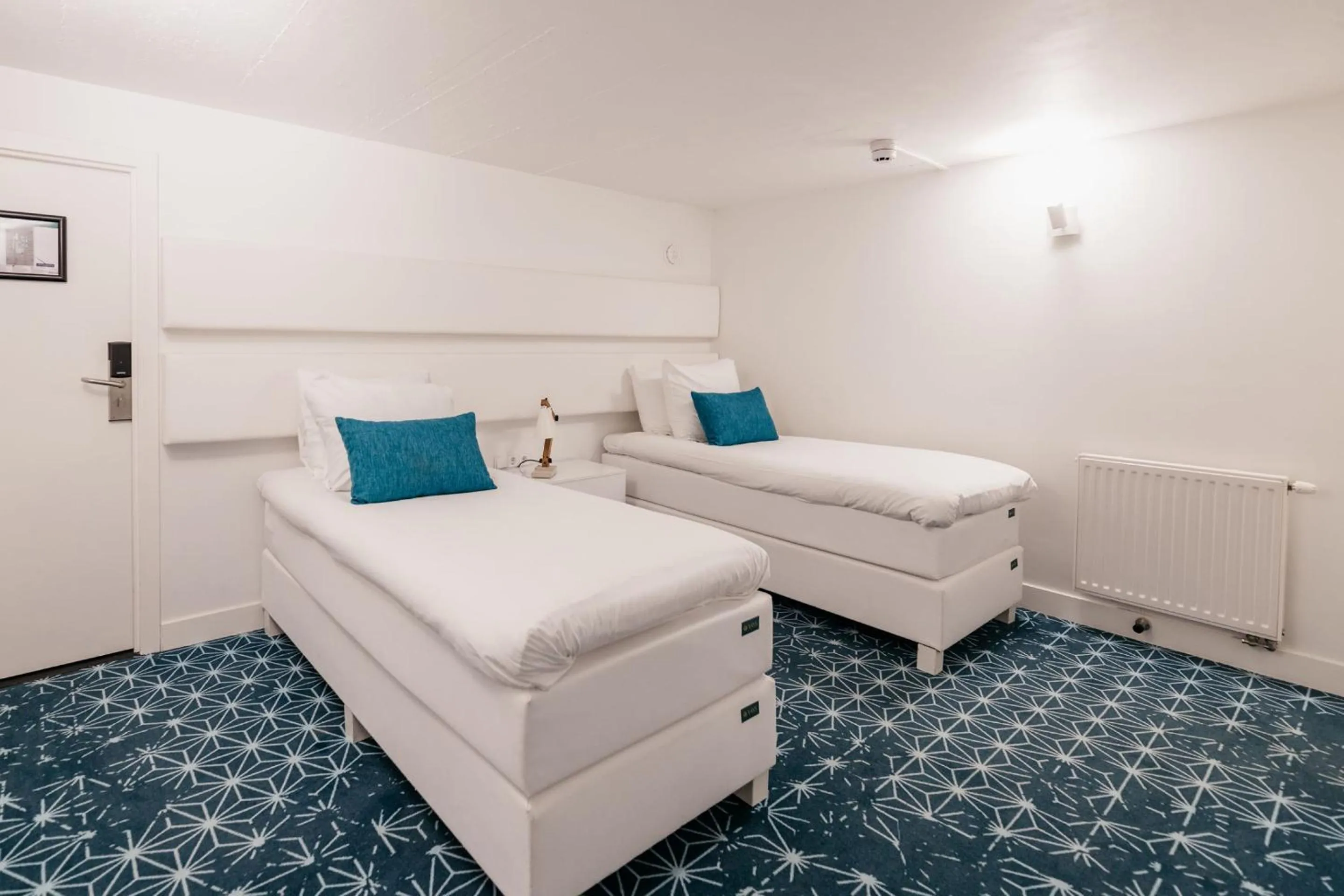 Bed in YAYS Amsterdam Salthouse Canal by Numa