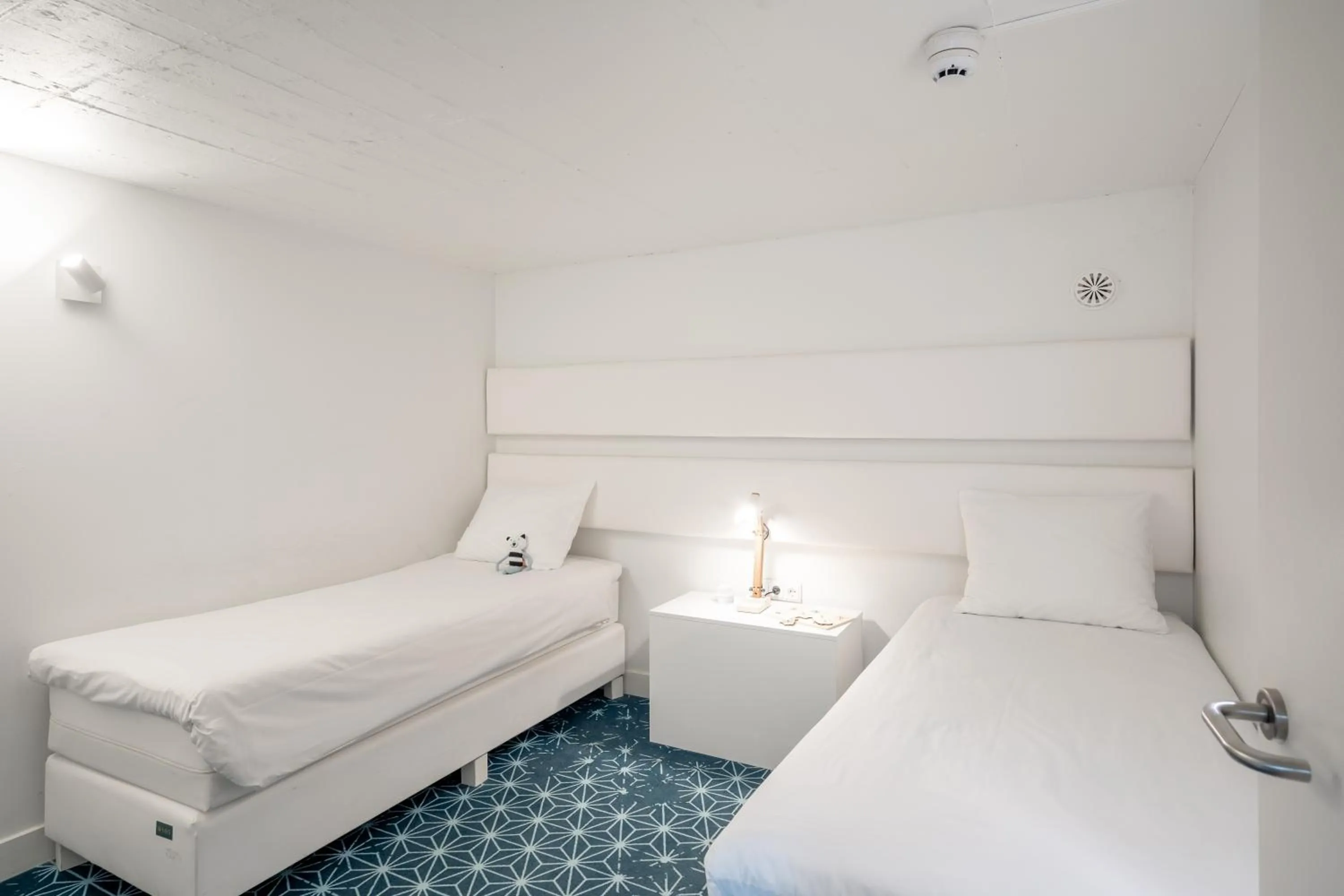 Bed in YAYS Amsterdam Salthouse Canal by Numa