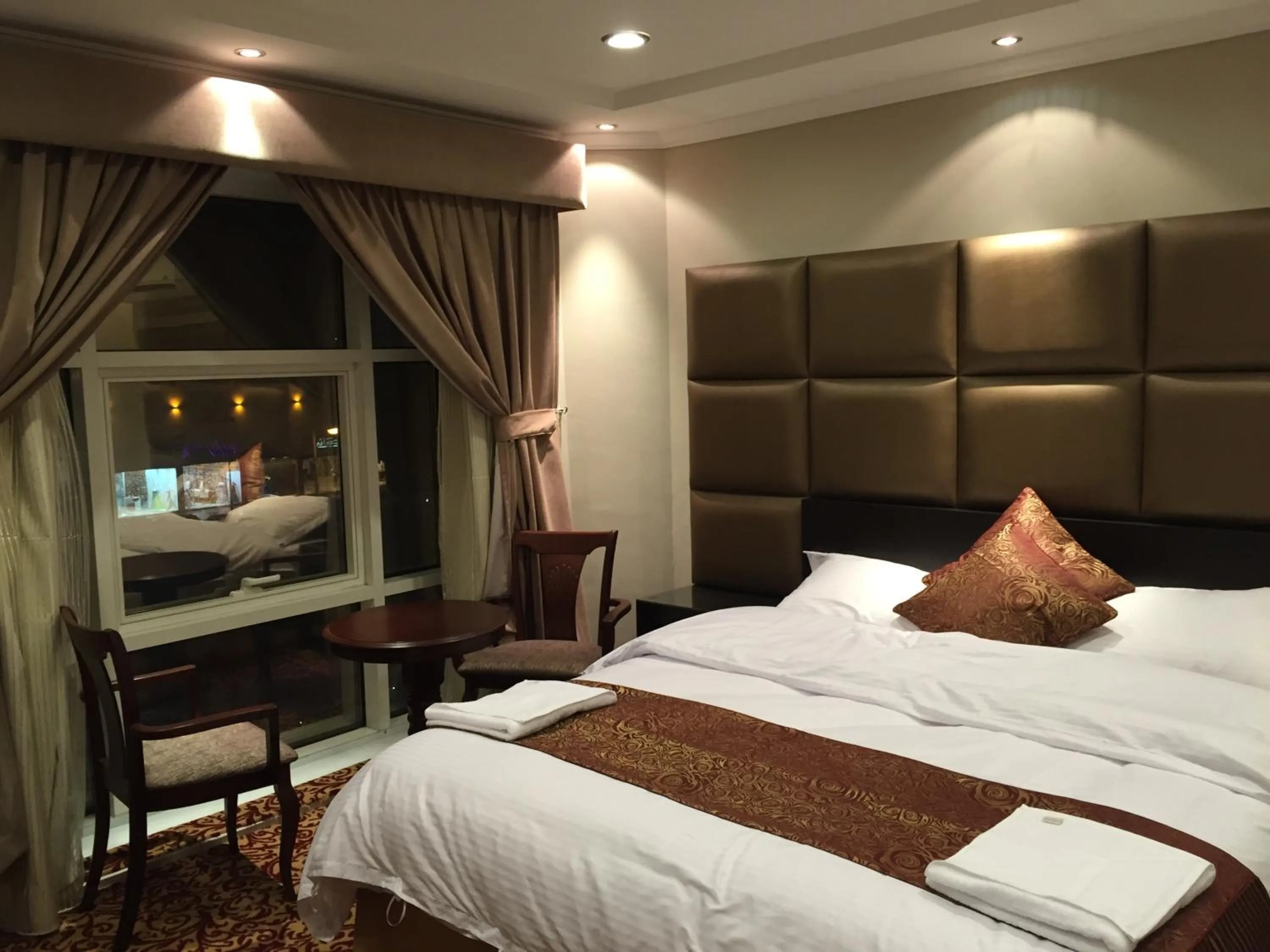Bed in Ashbonh Hotel Suites