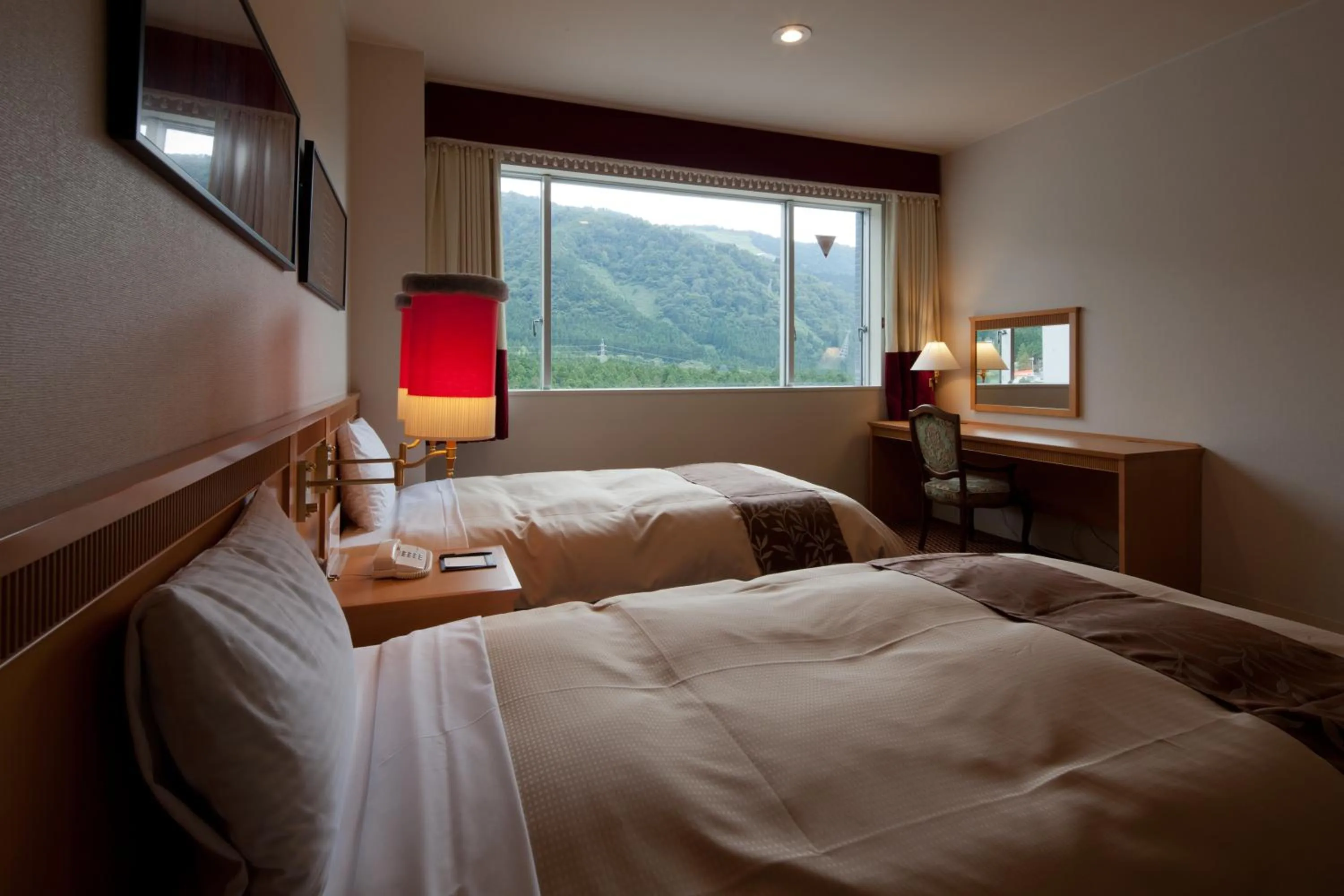 Bedroom, Bed in Hotel Morinokaze Tateyama‎