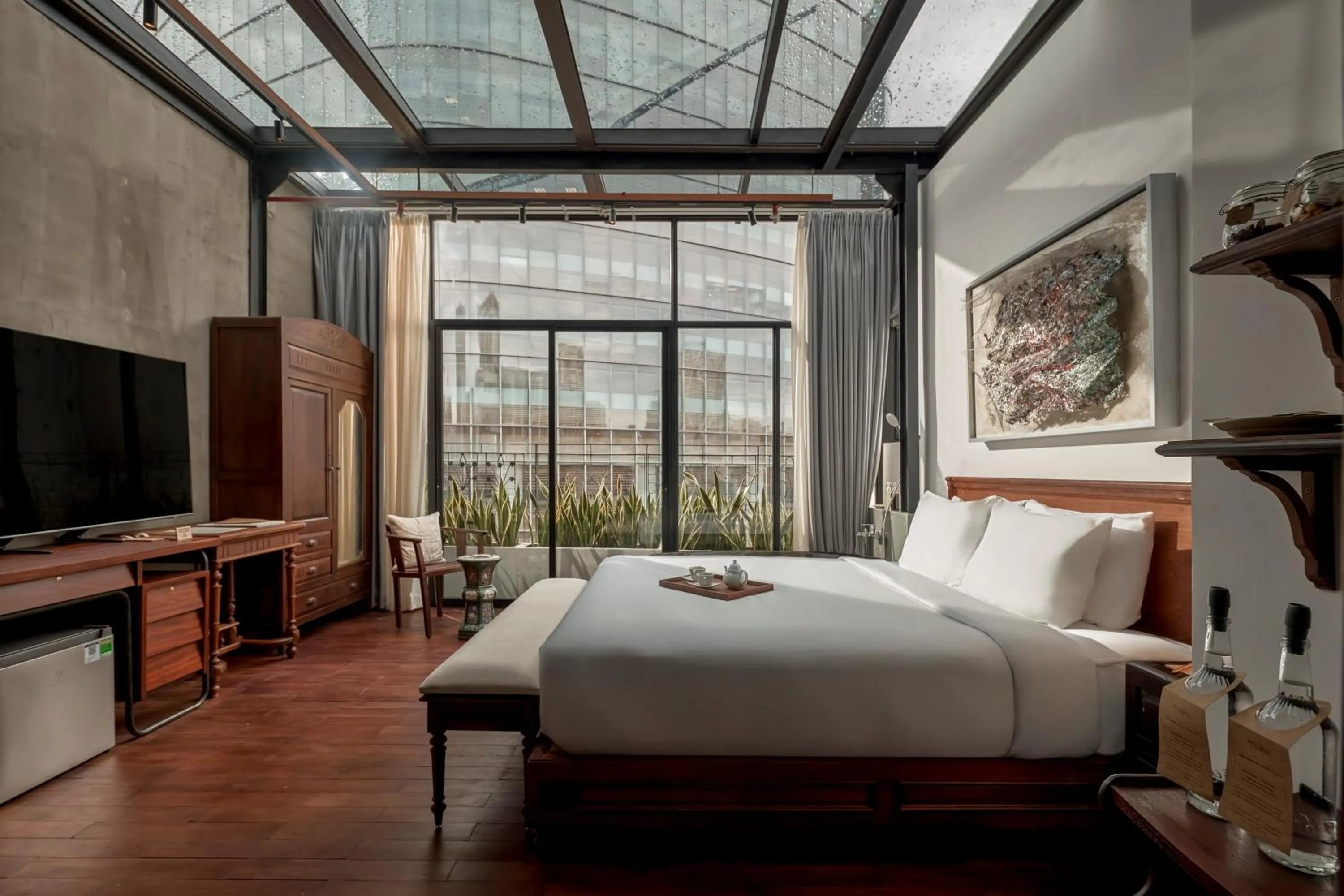 Living room, Bed in Anima Saigon Boutique - Vietnamese Contemporary Art Hotel