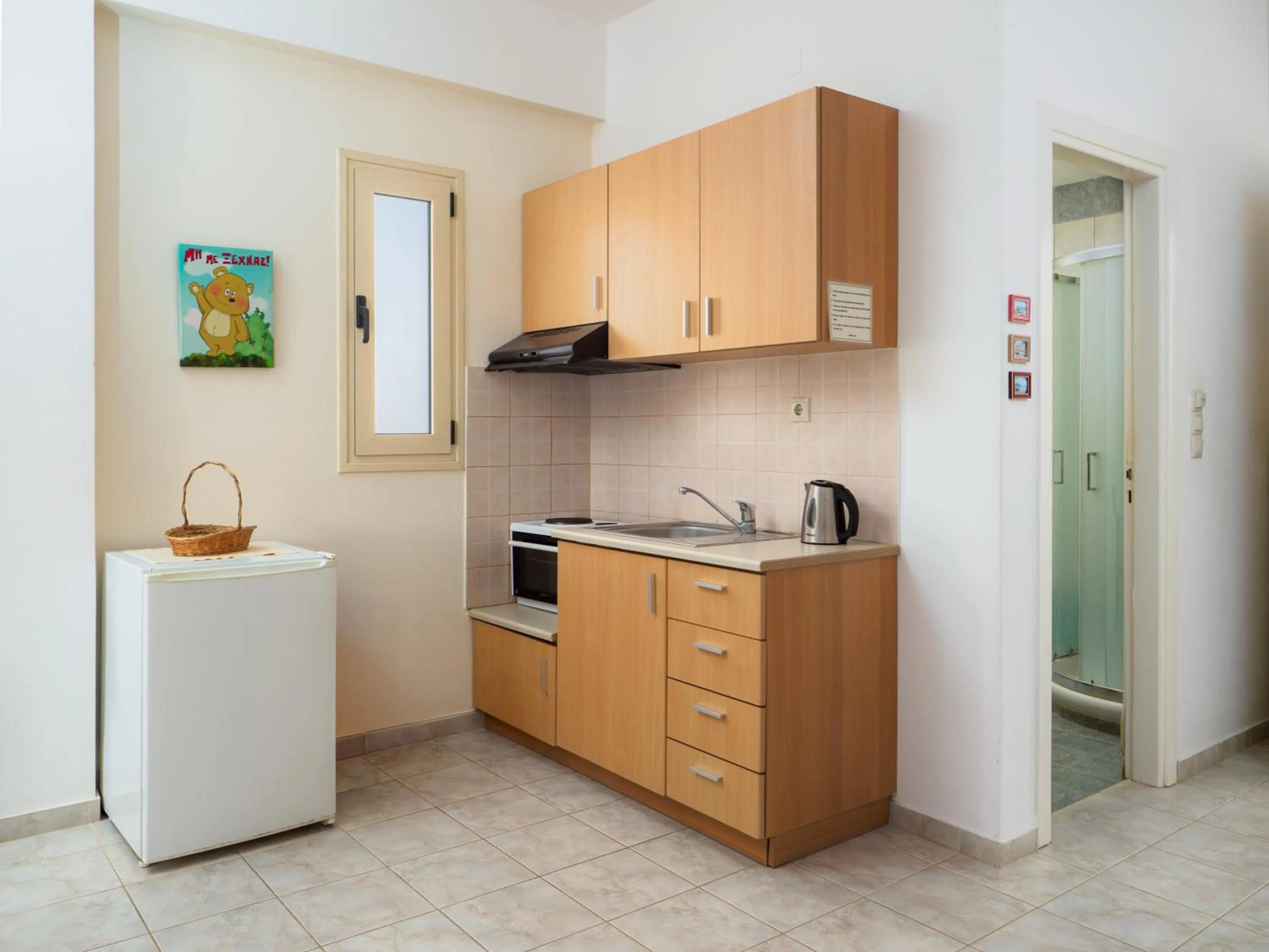 Kitchen or kitchenette in Fotis Studios Apartments