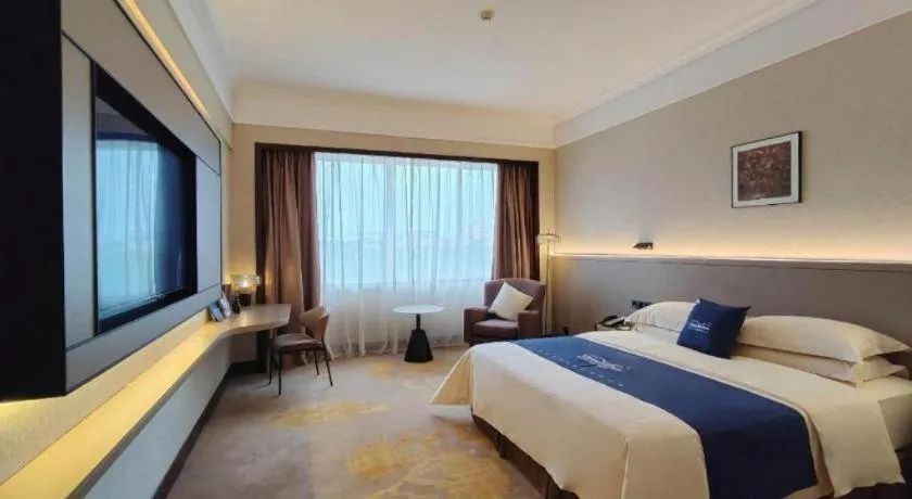 Bed in Fangzhong Holiday Hotel