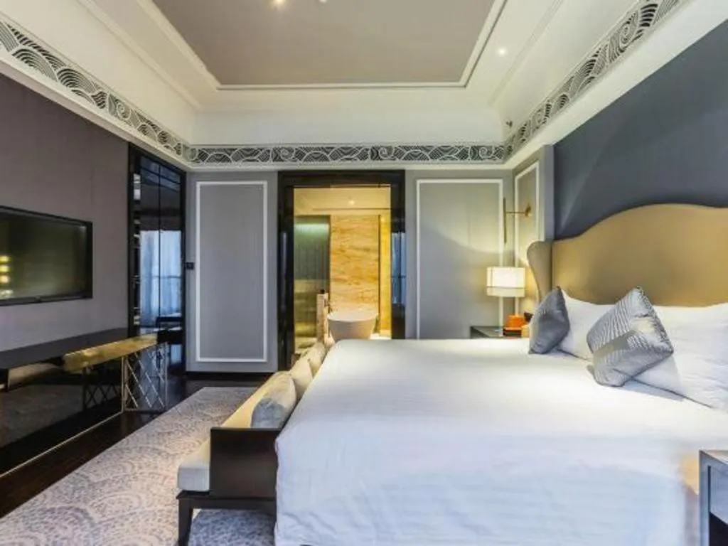 Bed in Grand New Century Hotel Yixing