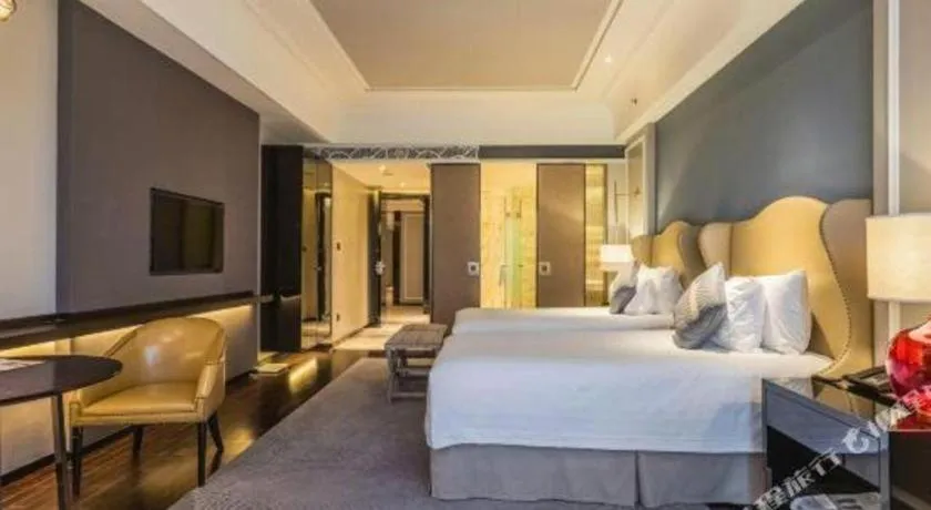 Bed in Grand New Century Hotel Yixing