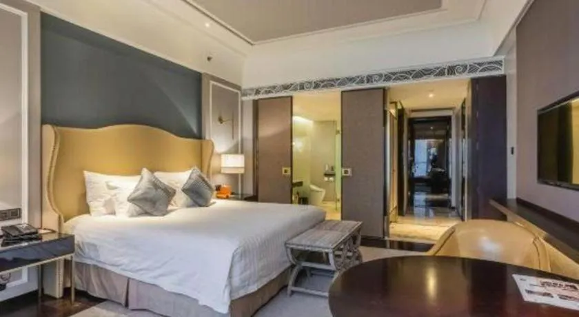 Bed in Grand New Century Hotel Yixing