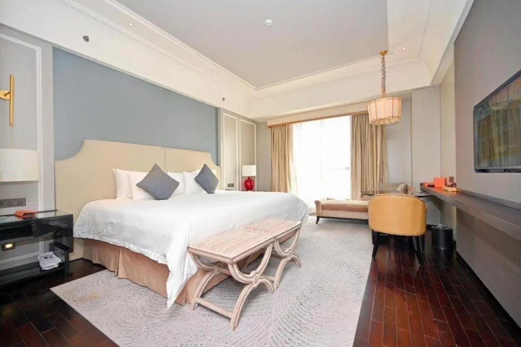 Bed in Grand New Century Hotel Yixing
