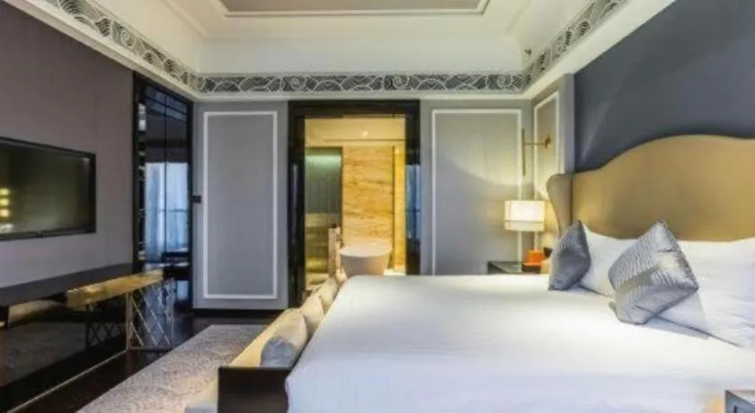 Bed in Grand New Century Hotel Yixing