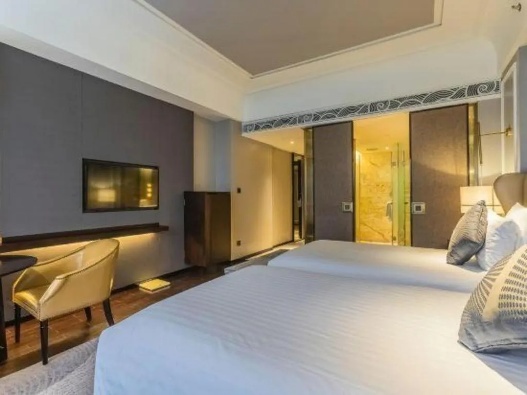 Bed in Grand New Century Hotel Yixing