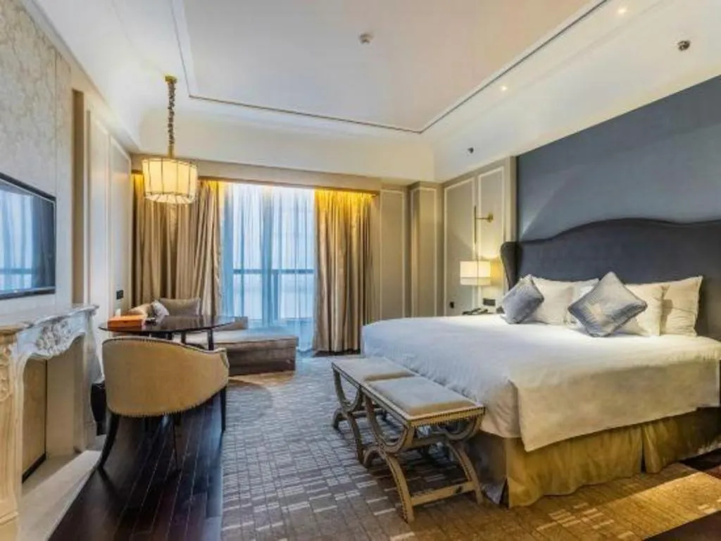 Bed in Grand New Century Hotel Yixing