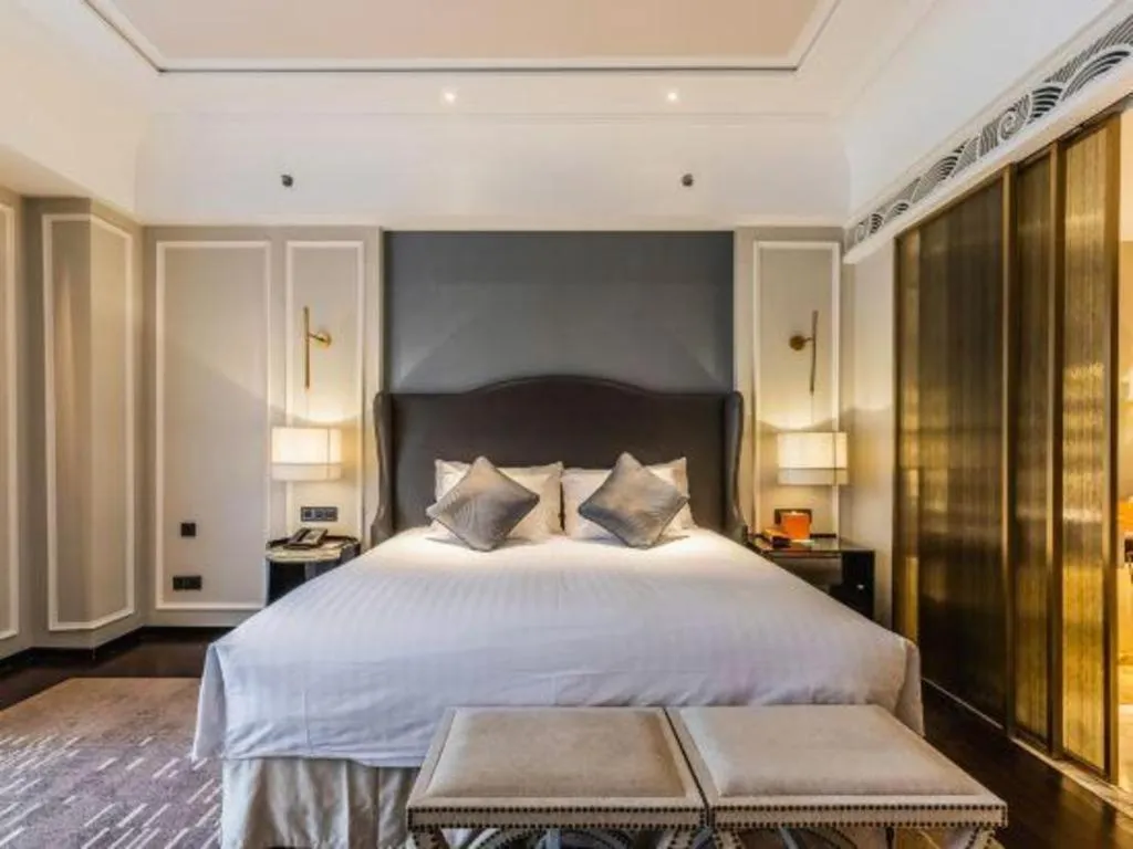 Bed in Grand New Century Hotel Yixing