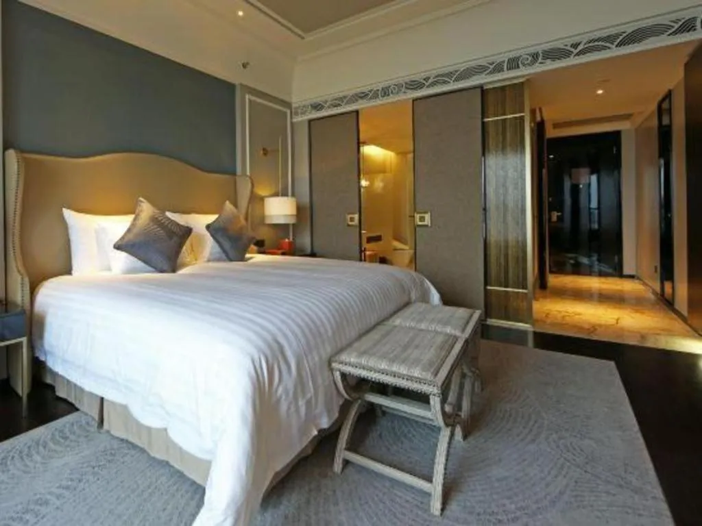 Bed in Grand New Century Hotel Yixing