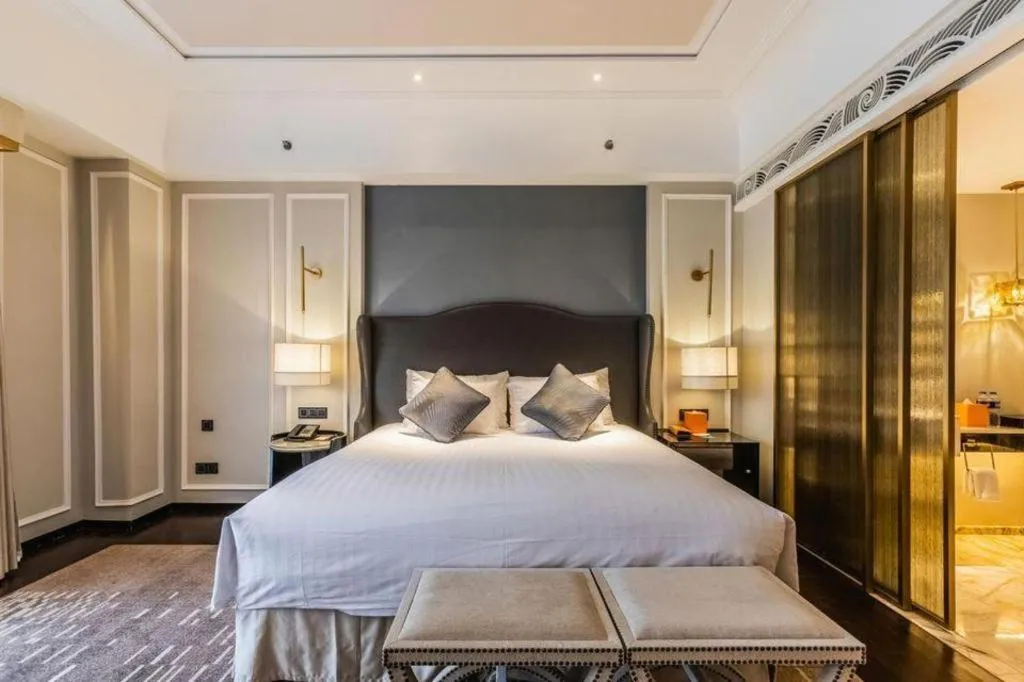 Bed in Grand New Century Hotel Yixing