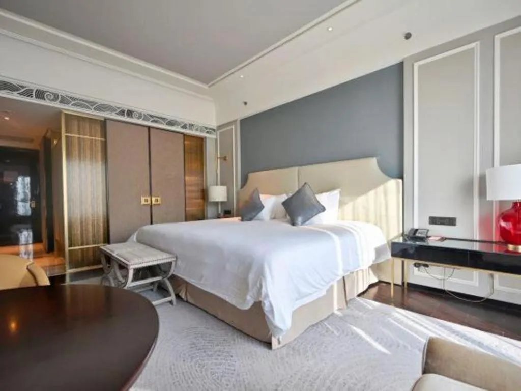 Bed in Grand New Century Hotel Yixing