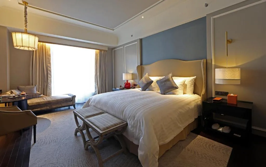 Bed in Grand New Century Hotel Yixing