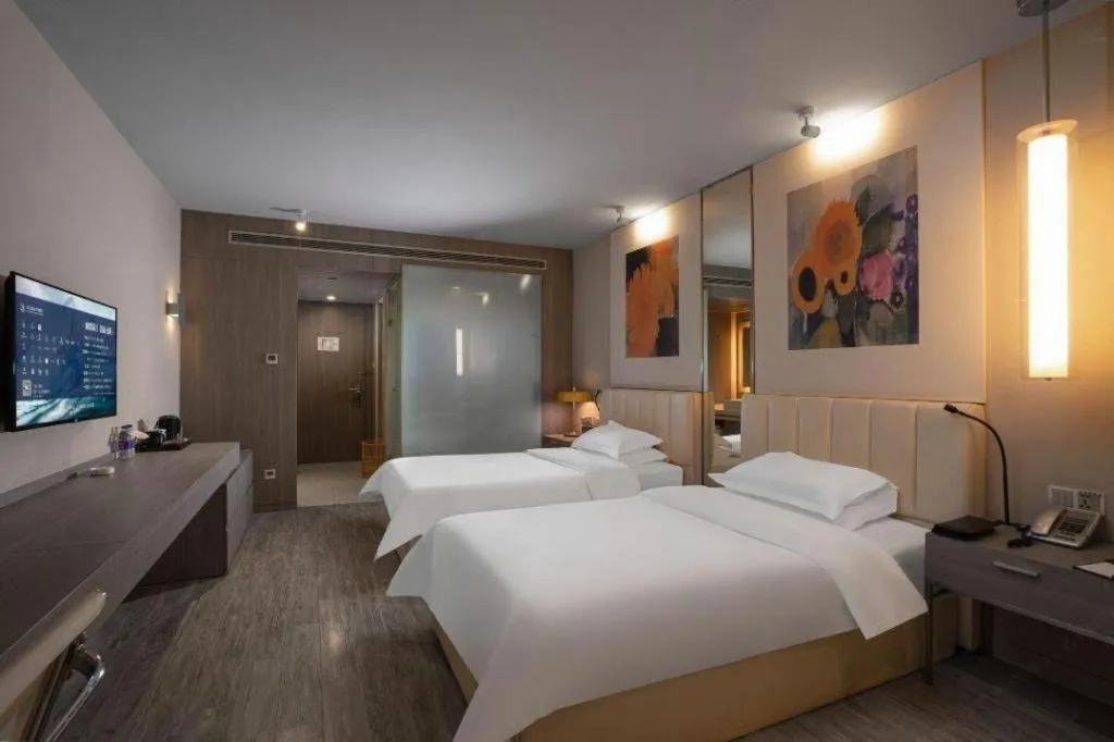 Bed in Jinjiang Metropolo Hotel Hangzhou Xiasha Jinsha Lake