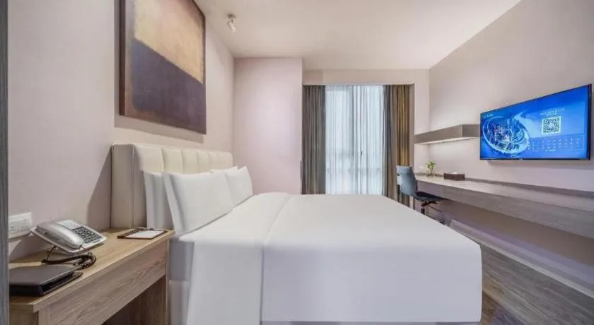 Bed in Jinjiang Metropolo Hotel Hangzhou Xiasha Jinsha Lake