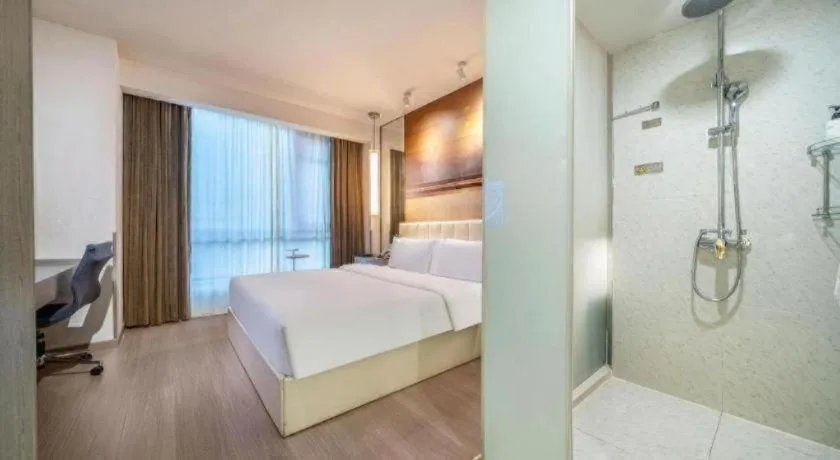 Bed in Jinjiang Metropolo Hotel Hangzhou Xiasha Jinsha Lake