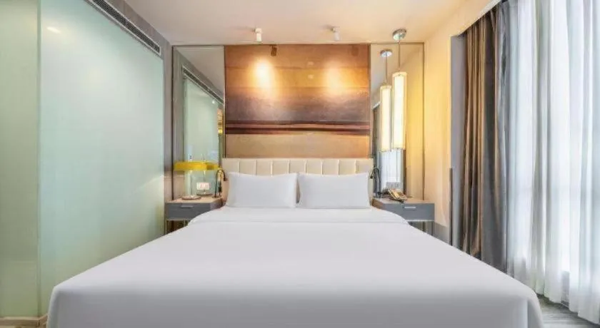 Bed in Jinjiang Metropolo Hotel Hangzhou Xiasha Jinsha Lake