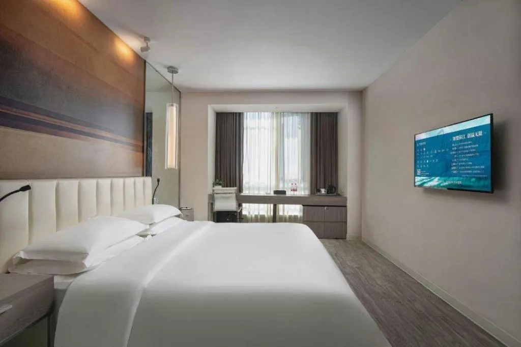 Bed in Jinjiang Metropolo Hotel Hangzhou Xiasha Jinsha Lake