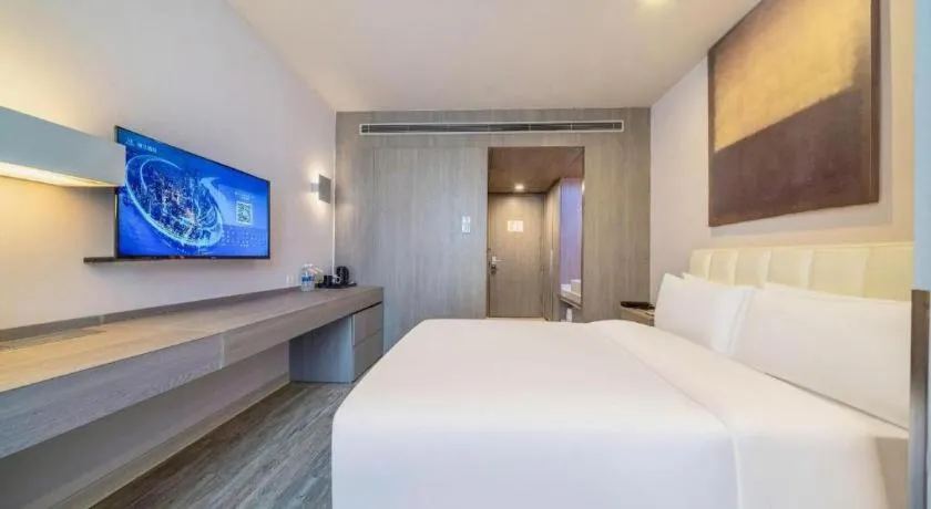 Bed in Jinjiang Metropolo Hotel Hangzhou Xiasha Jinsha Lake