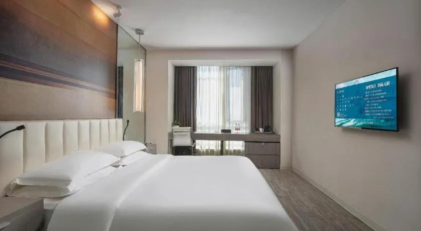 Bed in Jinjiang Metropolo Hotel Hangzhou Xiasha Jinsha Lake