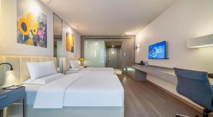 Bed in Jinjiang Metropolo Hotel Hangzhou Xiasha Jinsha Lake