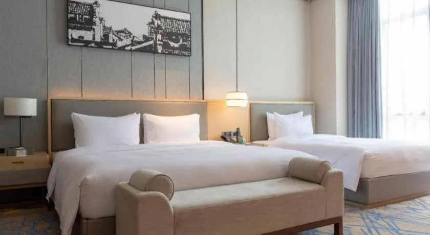 Bed in Zhuhai Tangyi Hotel