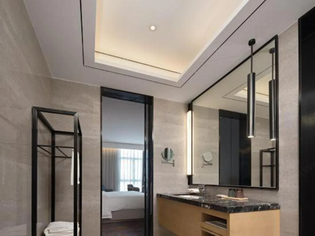 Bed in Zhuhai Tangyi Hotel