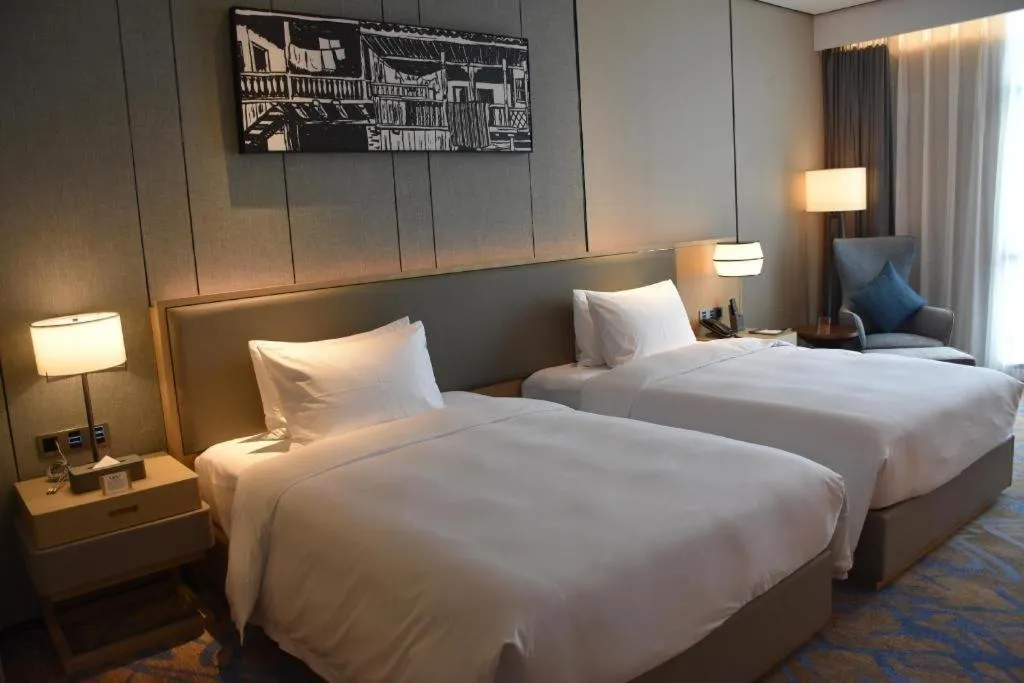 Bed in Zhuhai Tangyi Hotel