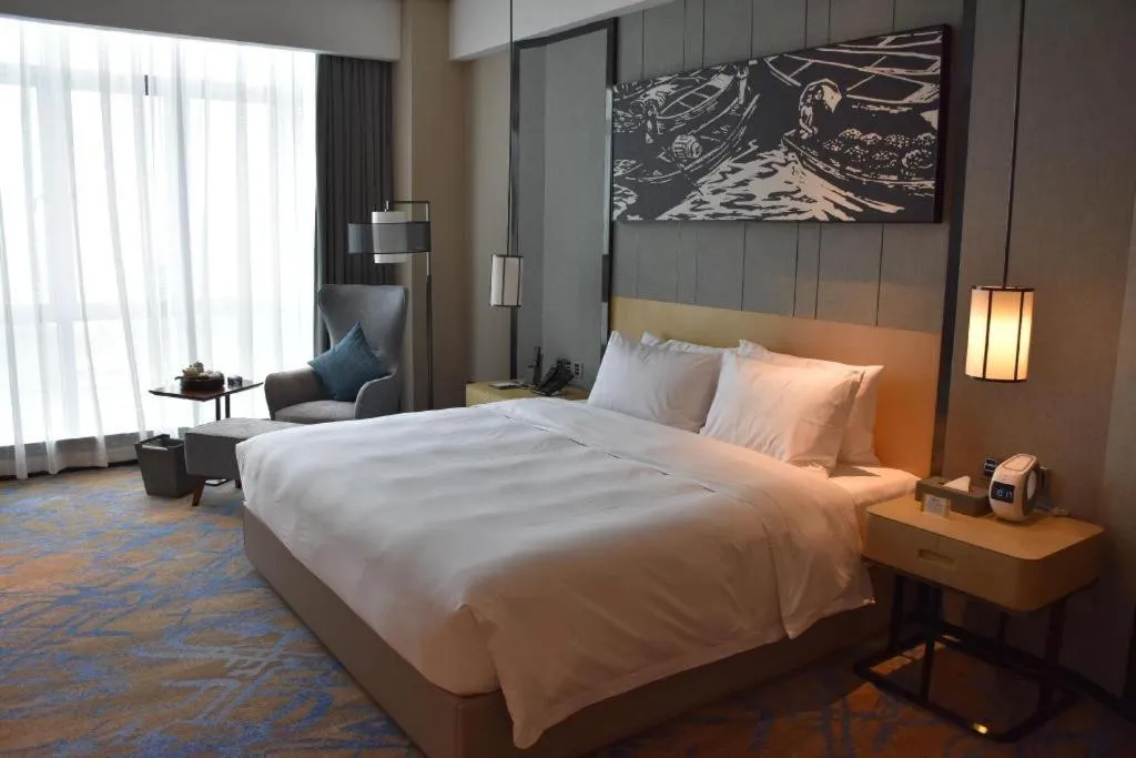 Bed in Zhuhai Tangyi Hotel