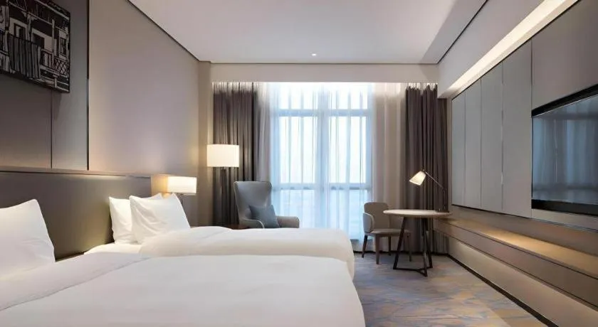 Bed in Zhuhai Tangyi Hotel